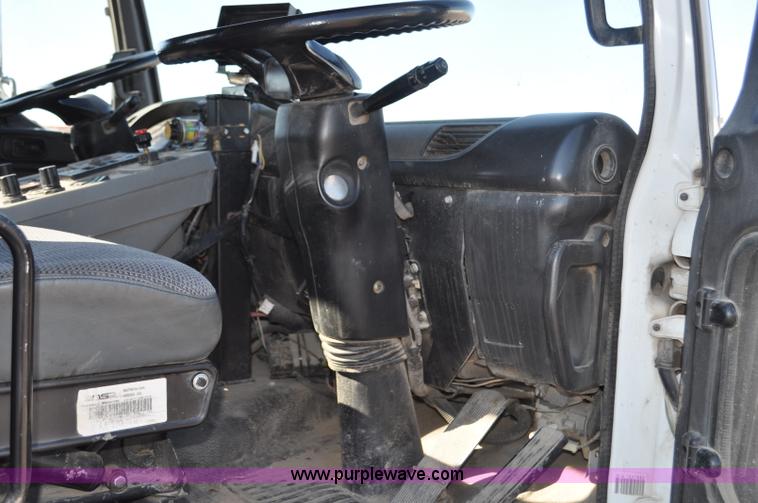 image for item F2050 1999 GMC T7500 Elgin street sweeper