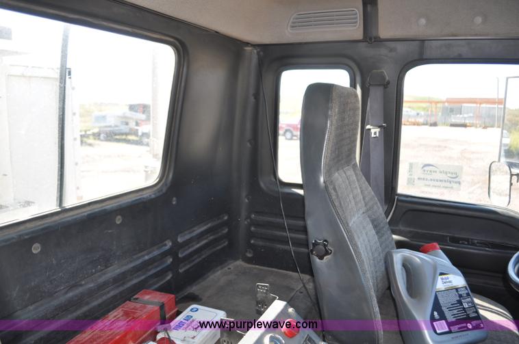 image for item F2050 1999 GMC T7500 Elgin street sweeper