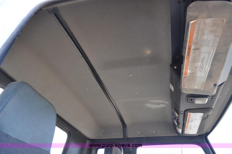 image for item F2050 1999 GMC T7500 Elgin street sweeper