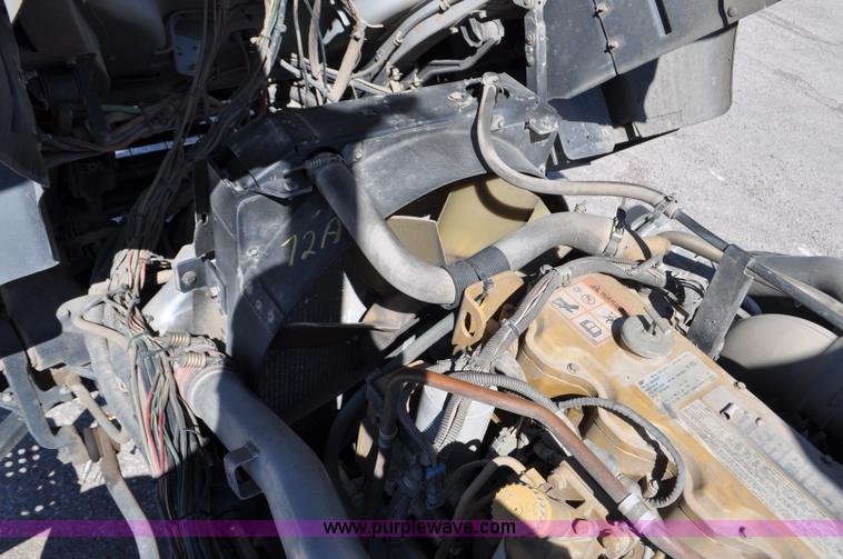 image for item F2050 1999 GMC T7500 Elgin street sweeper