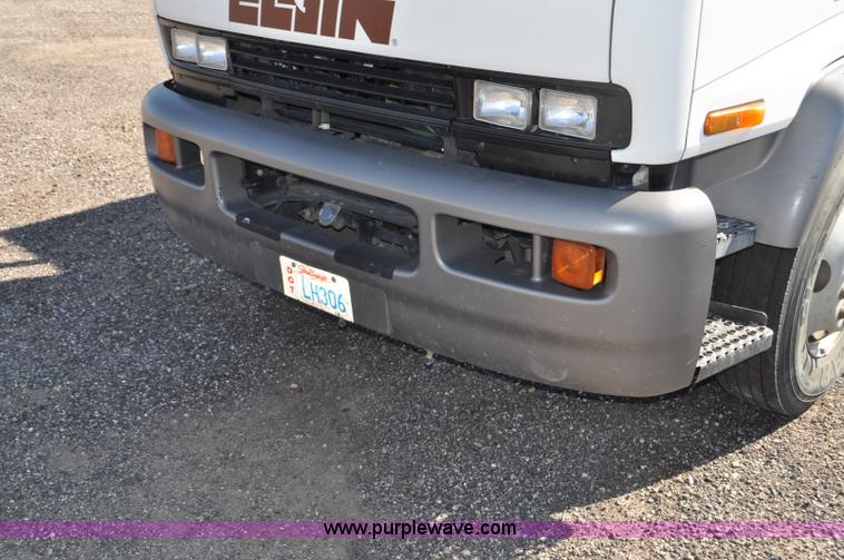 image for item F2050 1999 GMC T7500 Elgin street sweeper