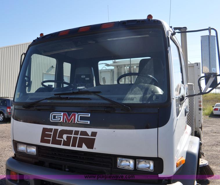 image for item F2050 1999 GMC T7500 Elgin street sweeper