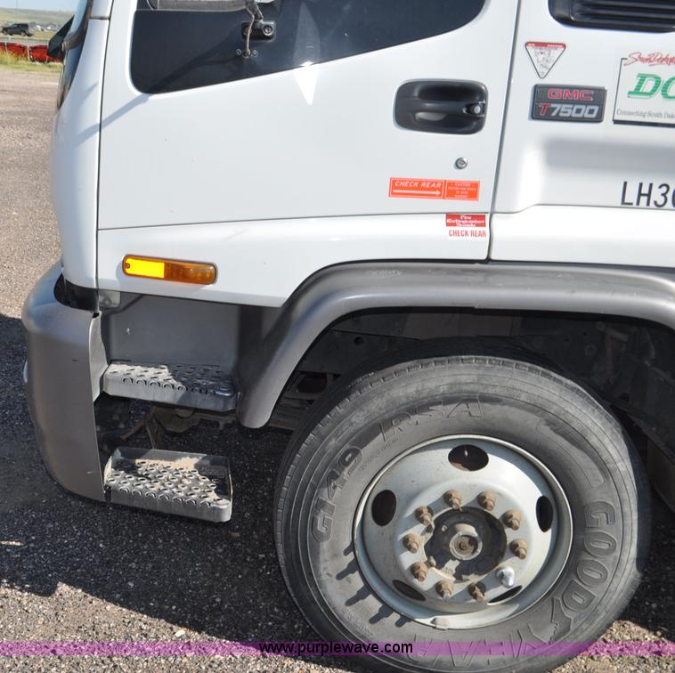 image for item F2050 1999 GMC T7500 Elgin street sweeper