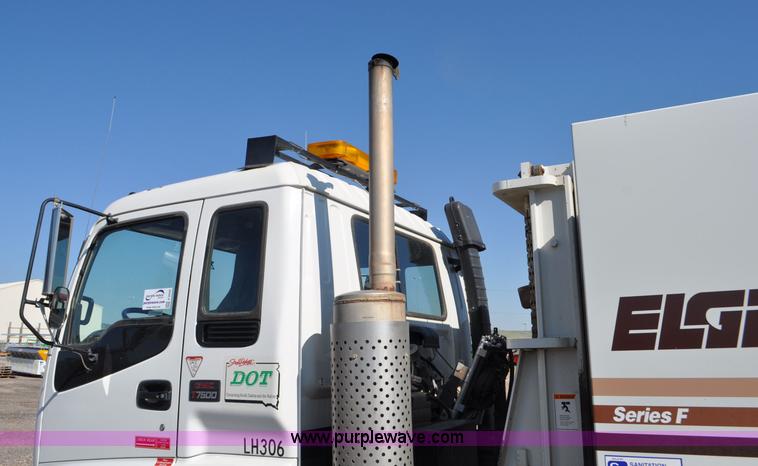 image for item F2050 1999 GMC T7500 Elgin street sweeper