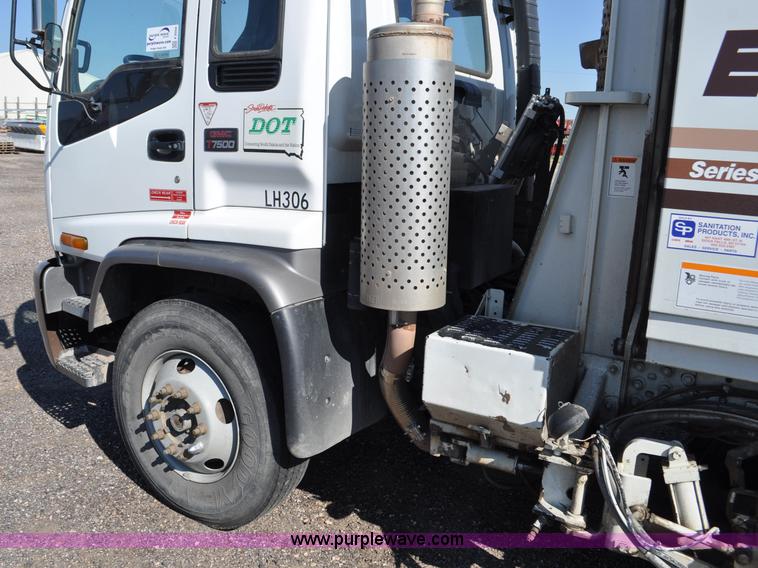 image for item F2050 1999 GMC T7500 Elgin street sweeper