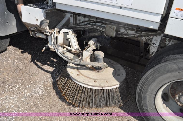 image for item F2050 1999 GMC T7500 Elgin street sweeper