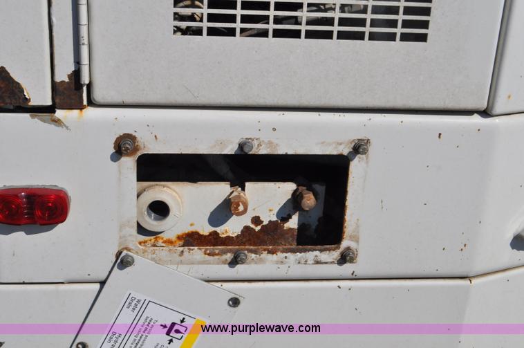 image for item F2050 1999 GMC T7500 Elgin street sweeper