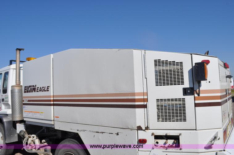 image for item F2050 1999 GMC T7500 Elgin street sweeper