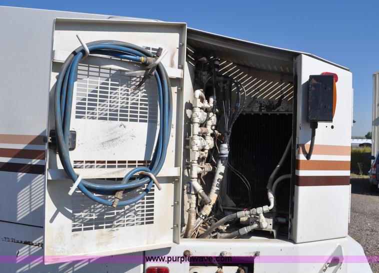 image for item F2050 1999 GMC T7500 Elgin street sweeper