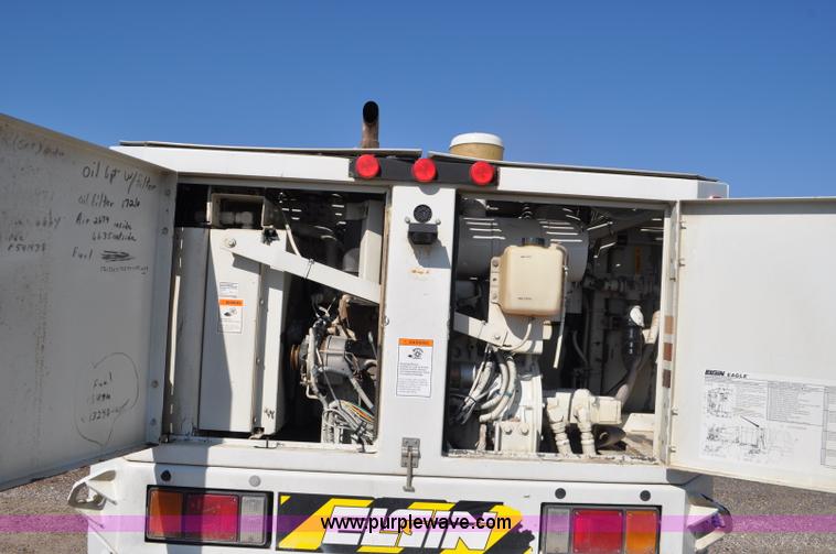 image for item F2050 1999 GMC T7500 Elgin street sweeper