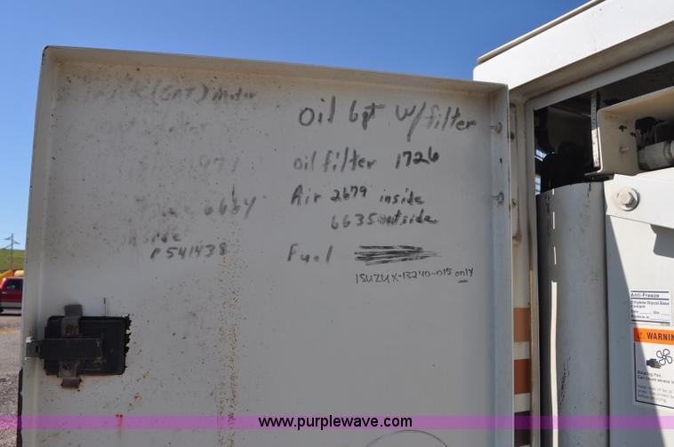 image for item F2050 1999 GMC T7500 Elgin street sweeper