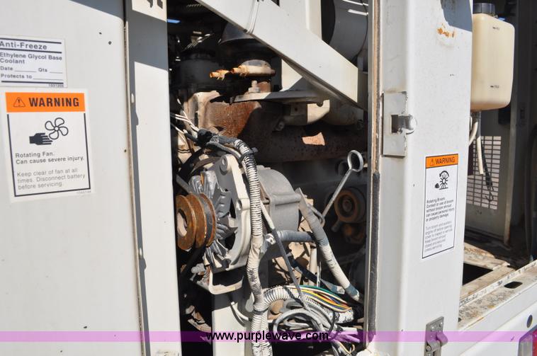 image for item F2050 1999 GMC T7500 Elgin street sweeper