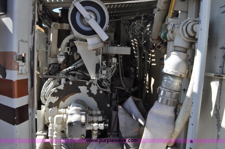 image for item F2050 1999 GMC T7500 Elgin street sweeper