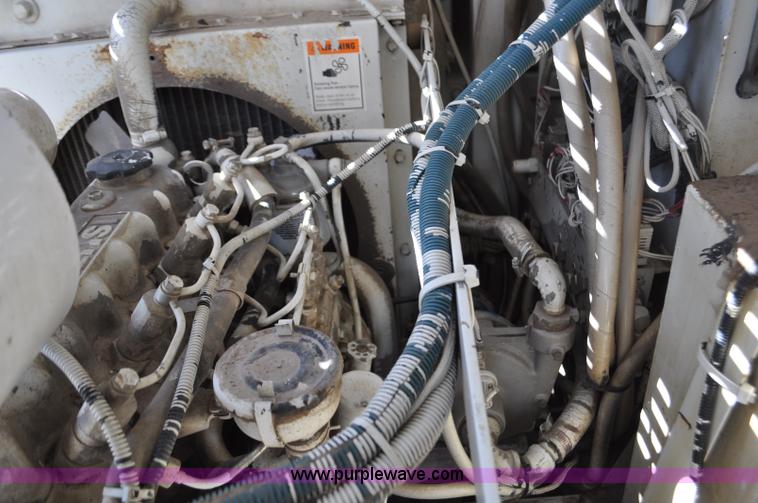 image for item F2050 1999 GMC T7500 Elgin street sweeper