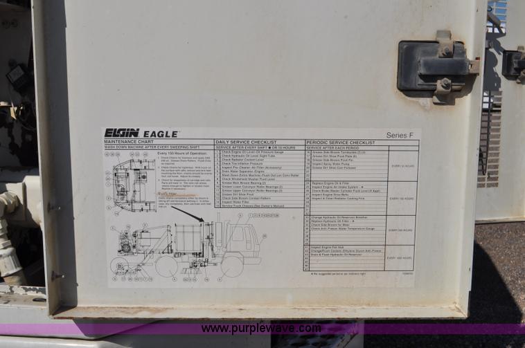 image for item F2050 1999 GMC T7500 Elgin street sweeper