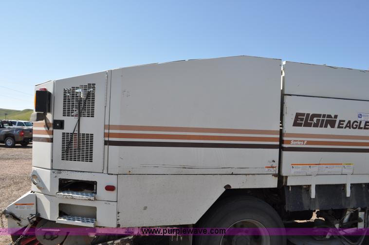 image for item F2050 1999 GMC T7500 Elgin street sweeper