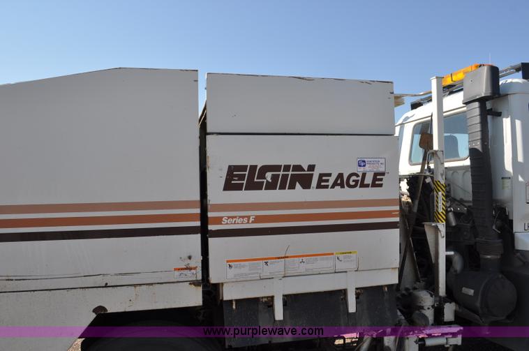 image for item F2050 1999 GMC T7500 Elgin street sweeper