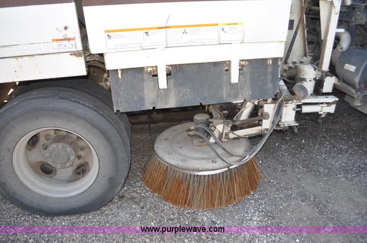 image for item F2050 1999 GMC T7500 Elgin street sweeper
