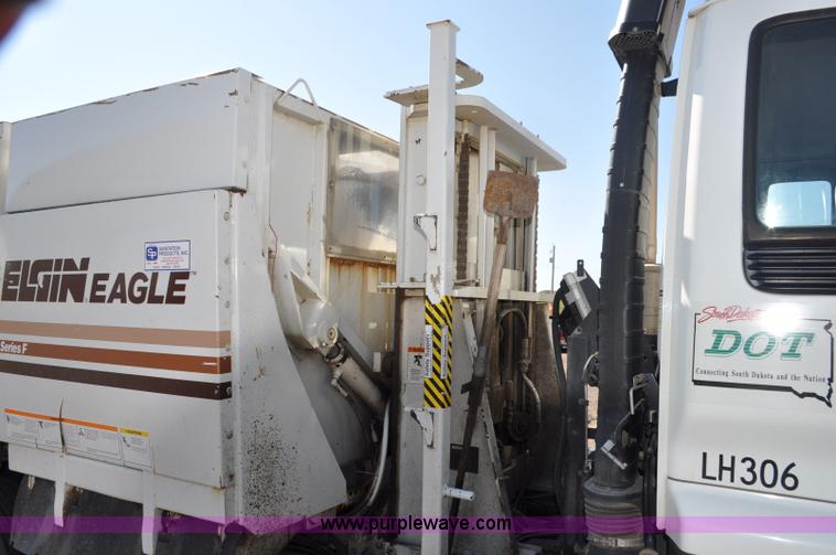 image for item F2050 1999 GMC T7500 Elgin street sweeper