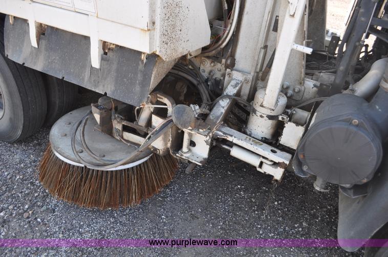 image for item F2050 1999 GMC T7500 Elgin street sweeper
