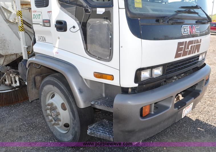 image for item F2050 1999 GMC T7500 Elgin street sweeper