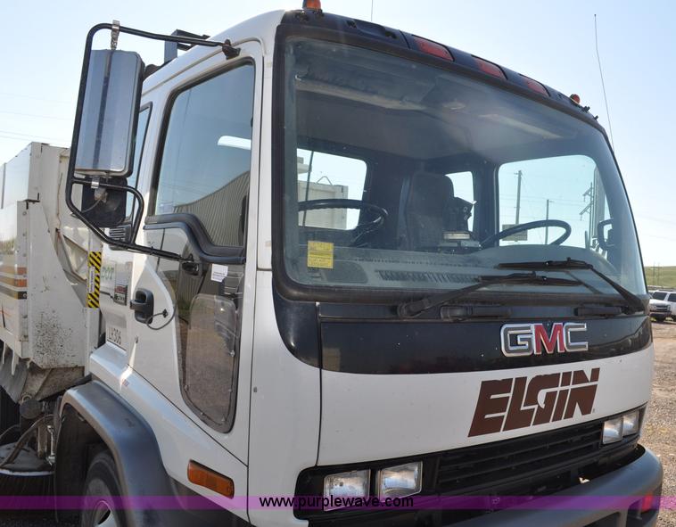 image for item F2050 1999 GMC T7500 Elgin street sweeper