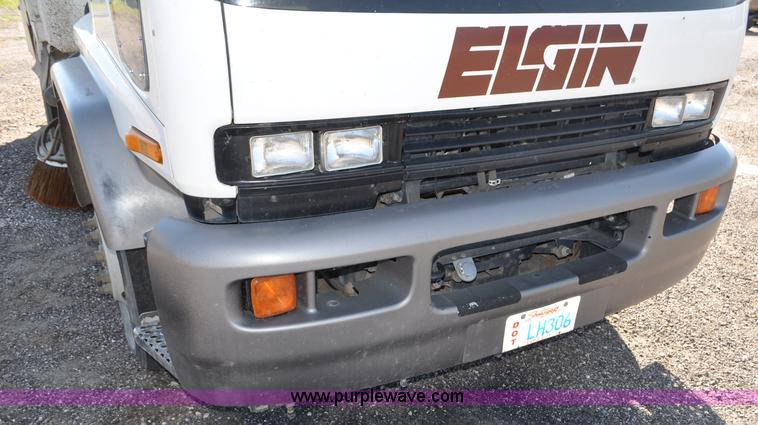 image for item F2050 1999 GMC T7500 Elgin street sweeper