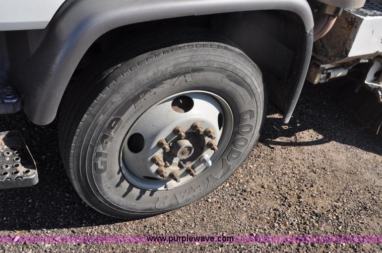 image for item F2050 1999 GMC T7500 Elgin street sweeper