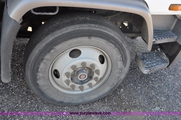 image for item F2050 1999 GMC T7500 Elgin street sweeper