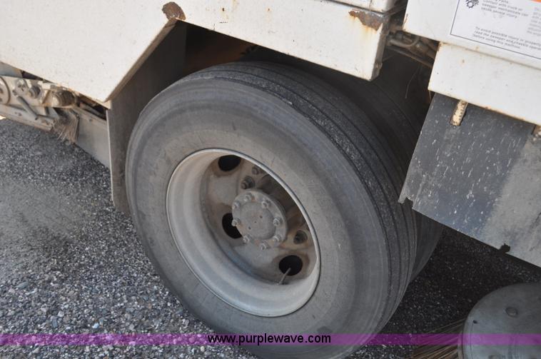 image for item F2050 1999 GMC T7500 Elgin street sweeper