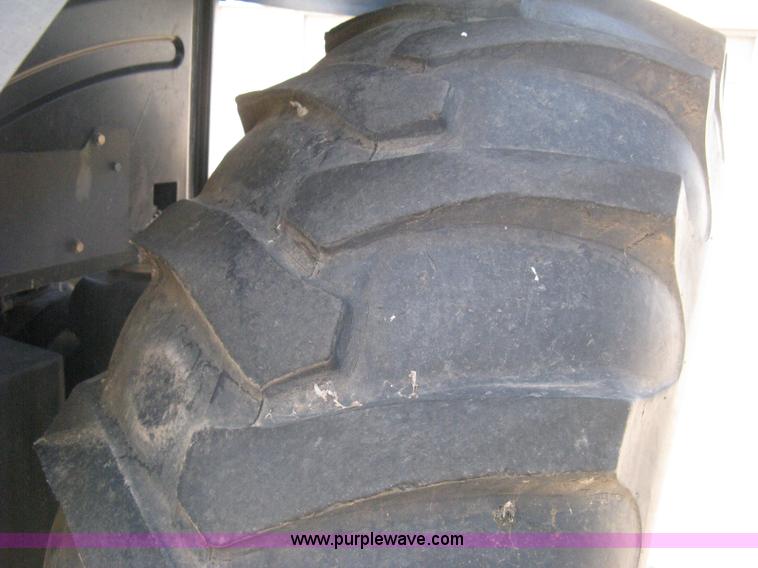 image for item H5311 2004 New Holland TS100A Plus tractor