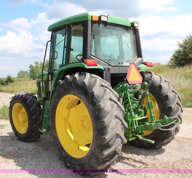 image for item J1089 1997 John Deere 6400 MFWD tractor