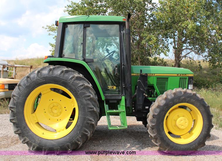 image for item J1089 1997 John Deere 6400 MFWD tractor