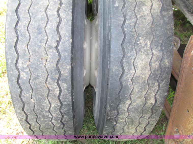 image for item F7159 1994 Fruehauf DAX-14-06D-F3-16 aluminum triple axle dump trailer