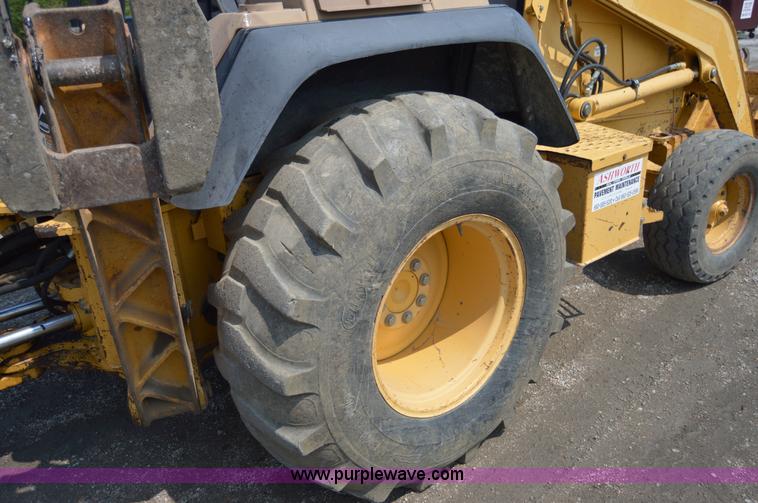 image for item H2828 1999 John Deere 310E backhoe