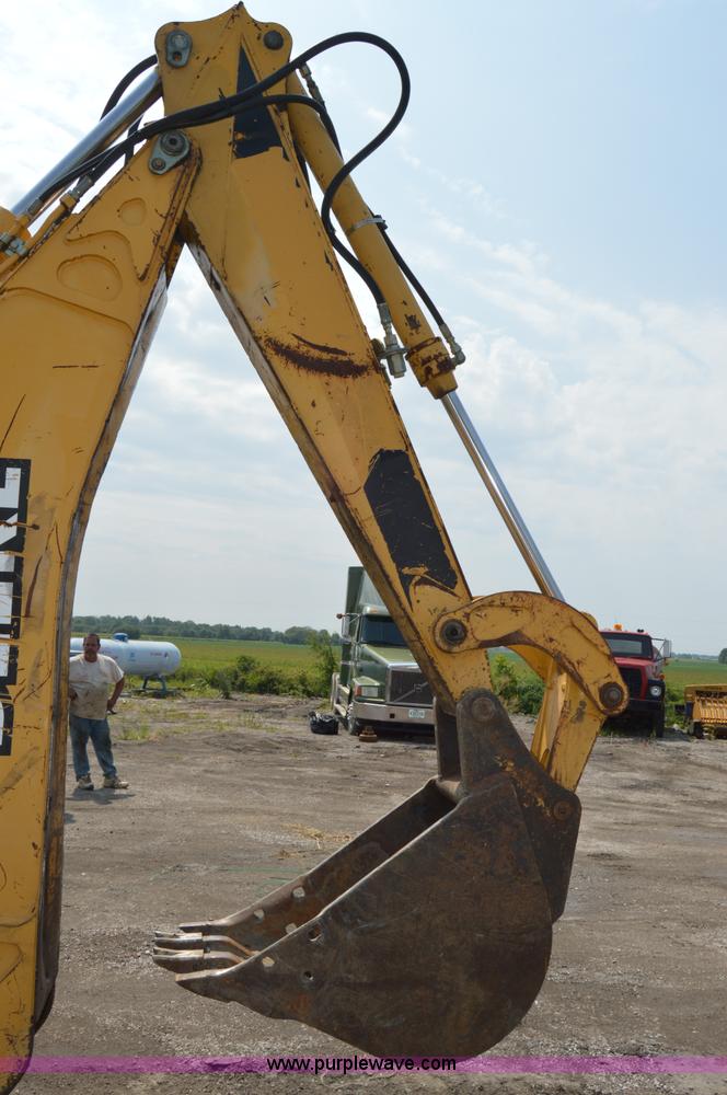 image for item H2828 1999 John Deere 310E backhoe