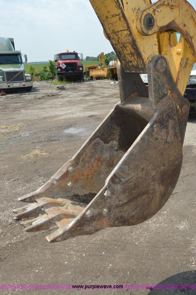 image for item H2828 1999 John Deere 310E backhoe