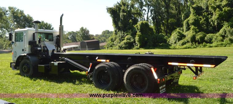 image for item H2874 1997 Mack MR688S roll off truck