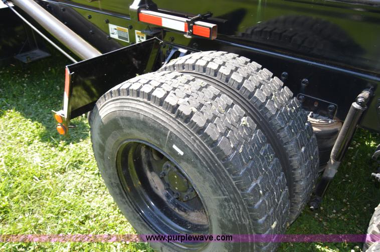 image for item H2874 1997 Mack MR688S roll off truck