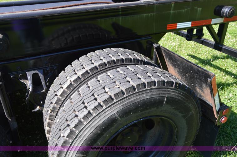 image for item H2874 1997 Mack MR688S roll off truck