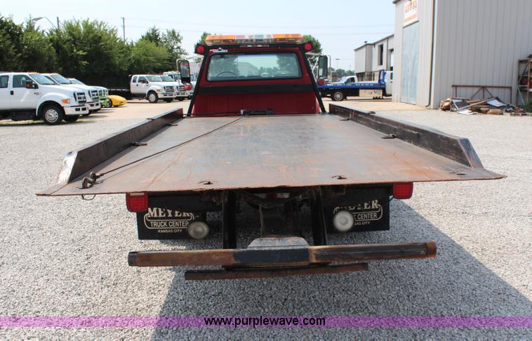 image for item J1080 1997 Ford F800 roll back truck