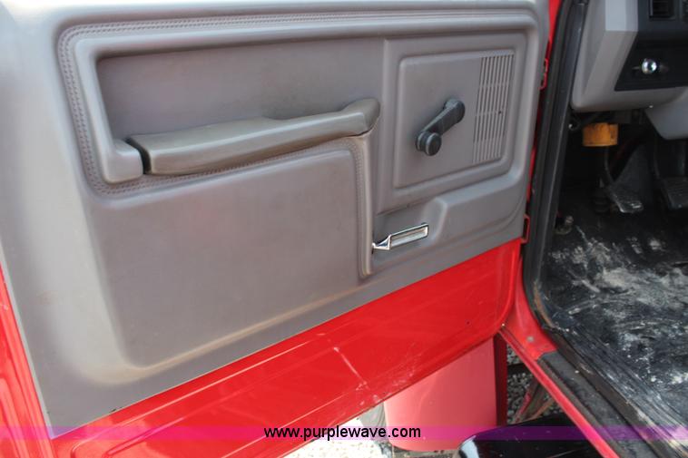 image for item J1080 1997 Ford F800 roll back truck