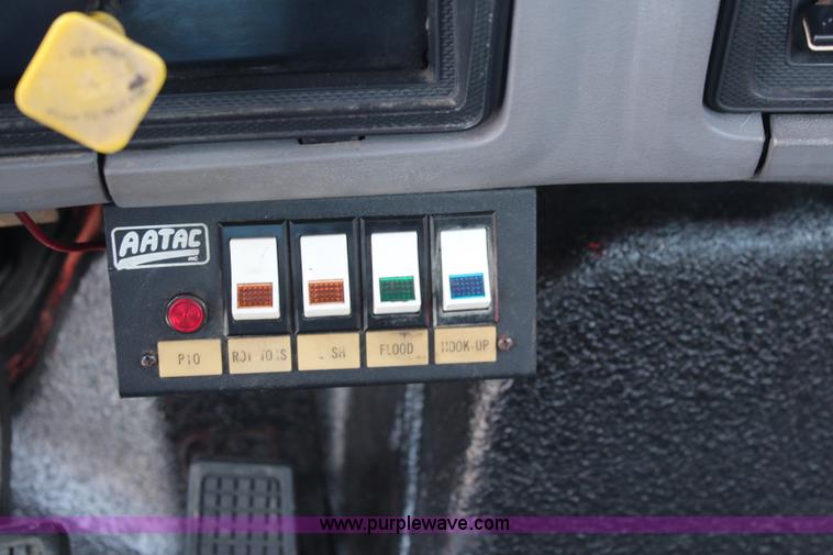 image for item J1080 1997 Ford F800 roll back truck