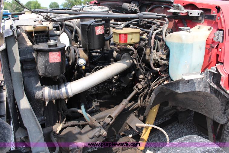 image for item J1080 1997 Ford F800 roll back truck