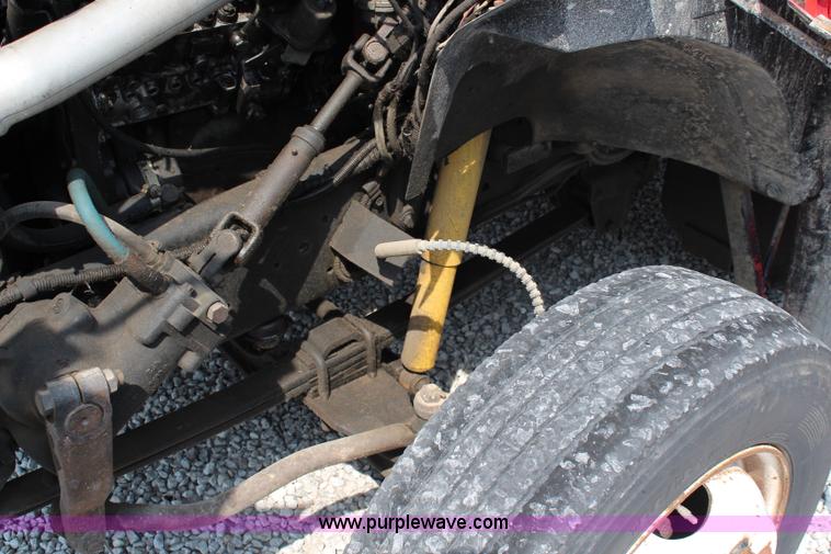 image for item J1080 1997 Ford F800 roll back truck