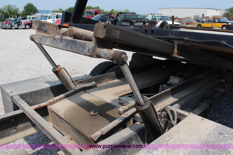 image for item J1080 1997 Ford F800 roll back truck