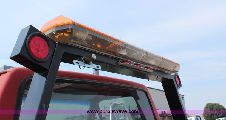 image for item J1080 1997 Ford F800 roll back truck