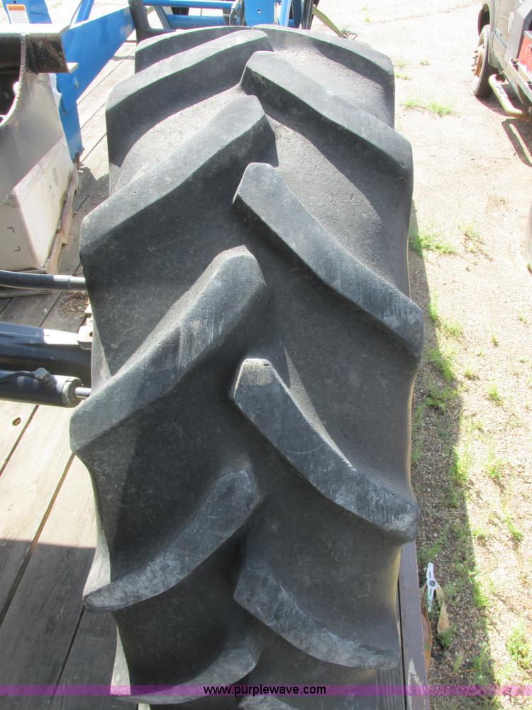 image for item I6197 1999 New Holland TS110 MFWD tractor