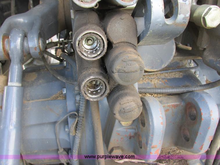 image for item I6197 1999 New Holland TS110 MFWD tractor