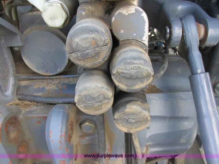 image for item I6197 1999 New Holland TS110 MFWD tractor